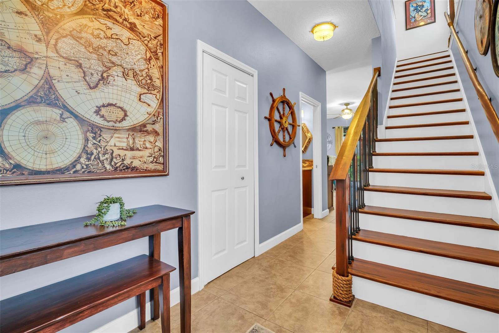 Stunning front entry with 9ft ceilings & an opened custom staircase~