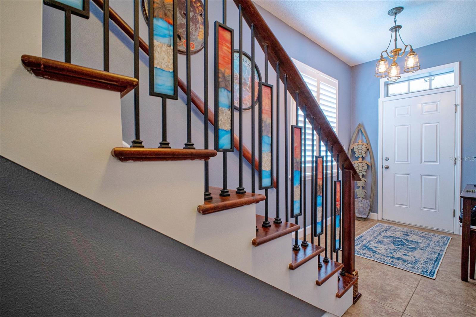 Recently remodeled & opened staircase with custom glass