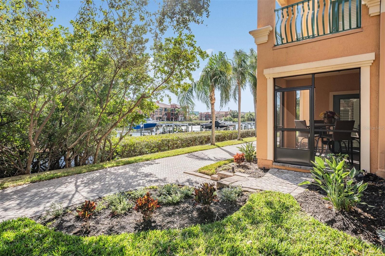 Corner screened patio overlooking canal