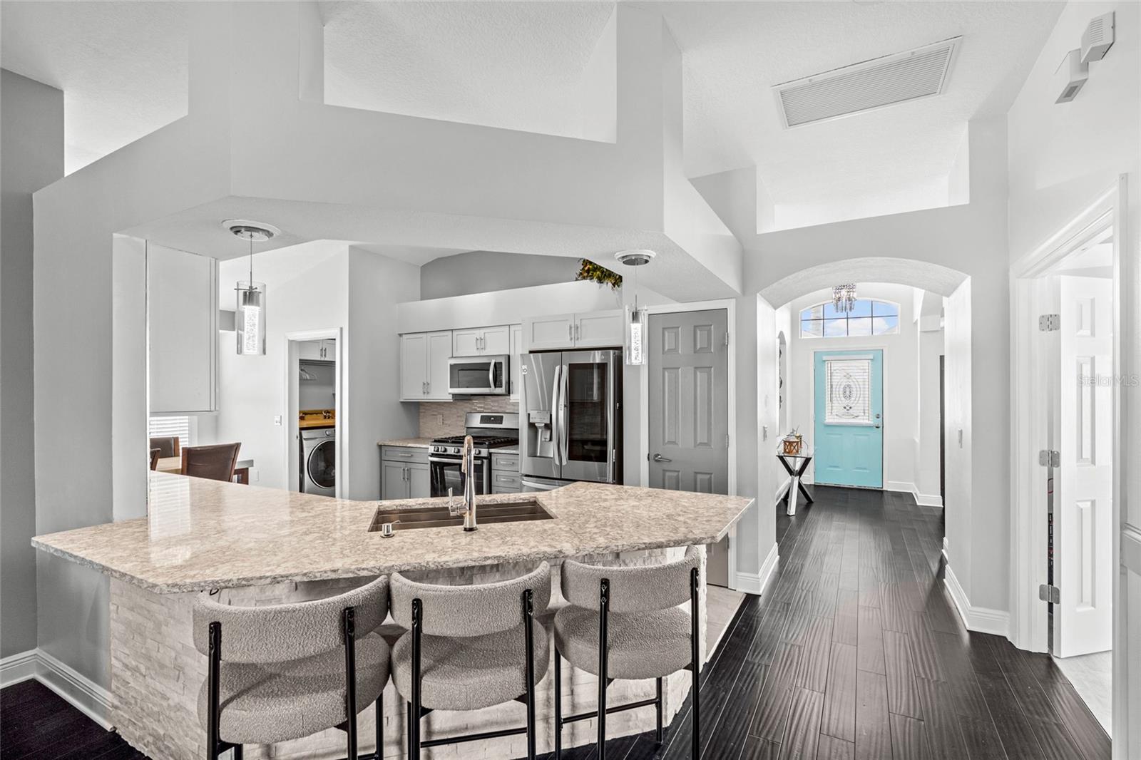 Beautiful open floor plan including breakfast bar facing the living room