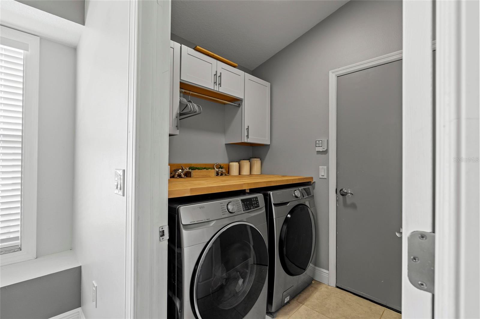 Indoor Laundry room with folding table off of the kitchen.