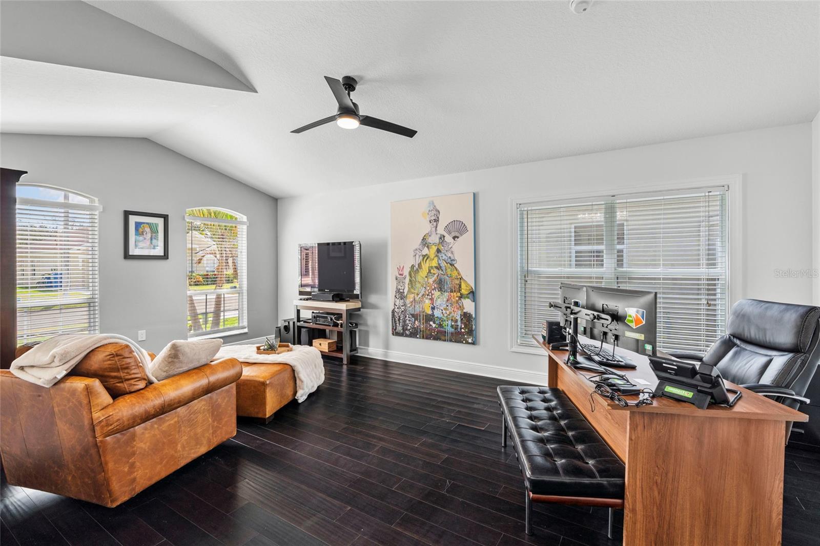 High ceilings and natural light make the space feel very open and grand right off the entry way