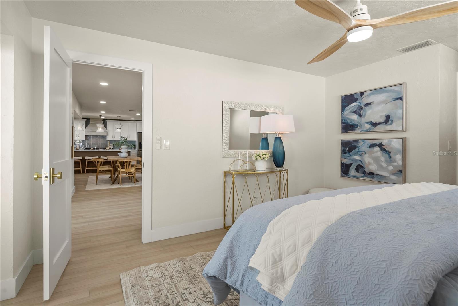 View of Primary bedroom with a peek into the living room/ dining area