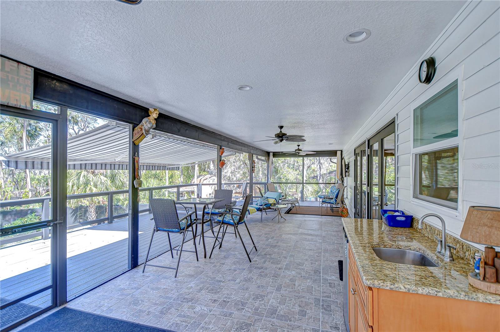 Enjoy this expansive screened patio, perfect for entertaining or simply soaking in the Florida sunshine.