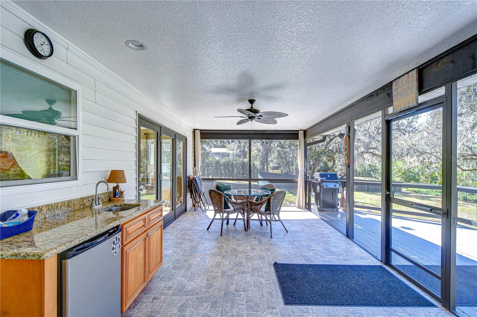 Enjoy the perfect blend of indoor and outdoor living featuring a mini bar and ample room