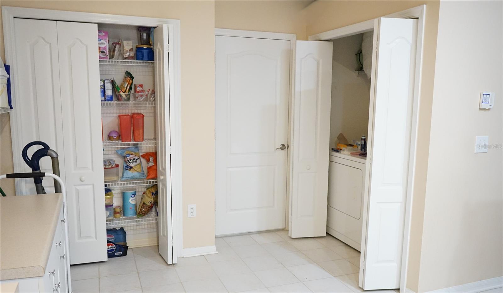 pantry, door to garage and laundry closet