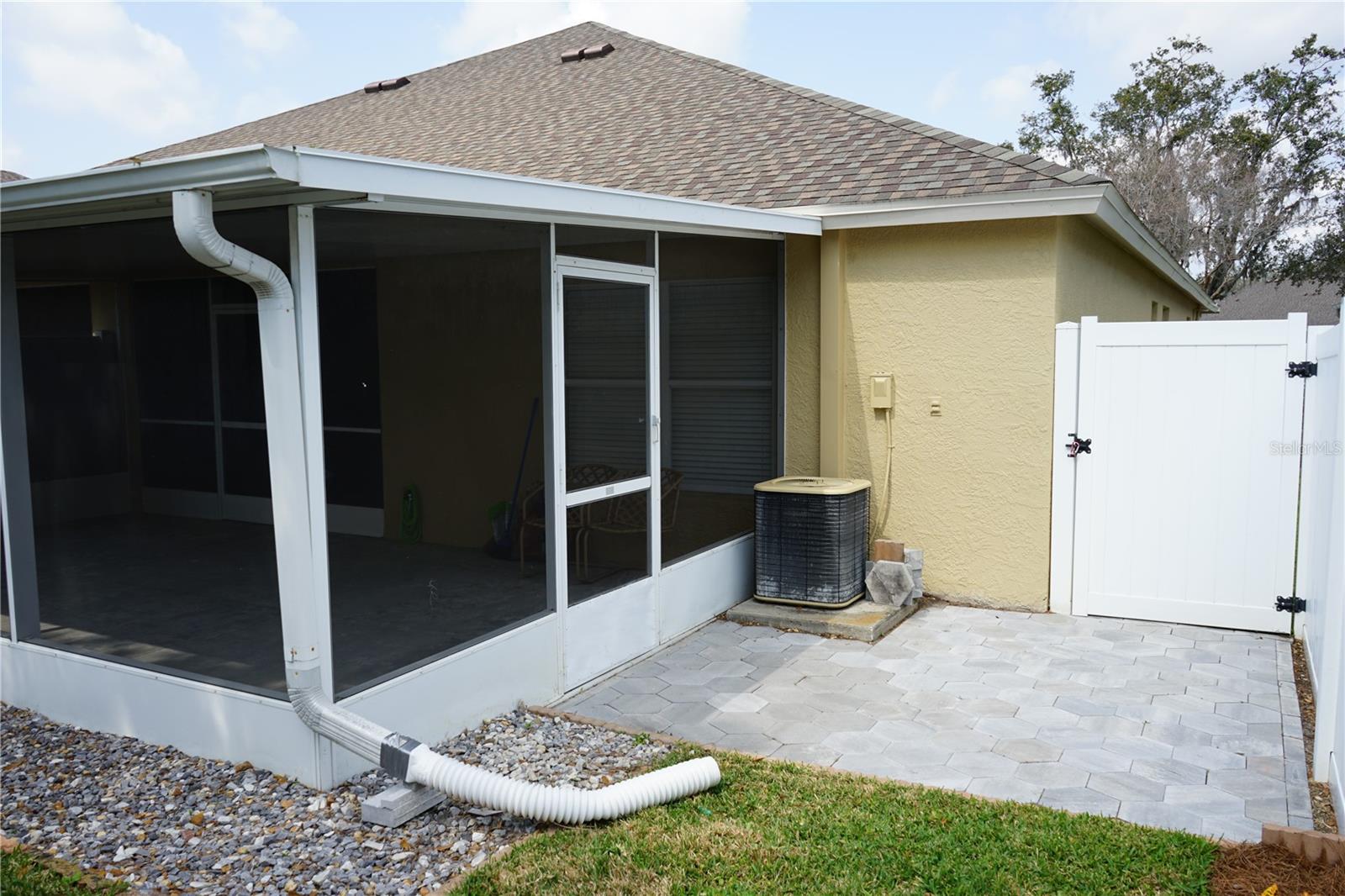 grill area and fence gate to side yard