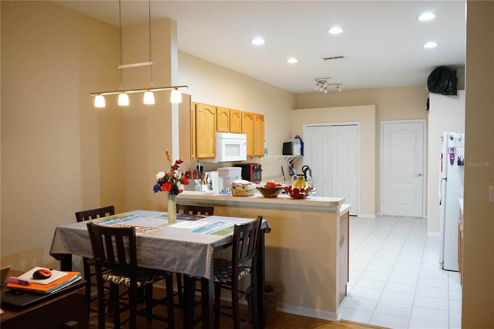 dining space and lots of lights in the kitchen