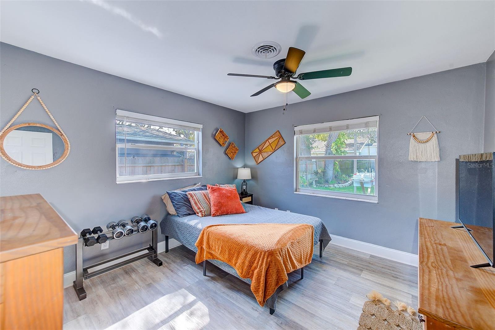 Second bedroom overlooking backyard oasis