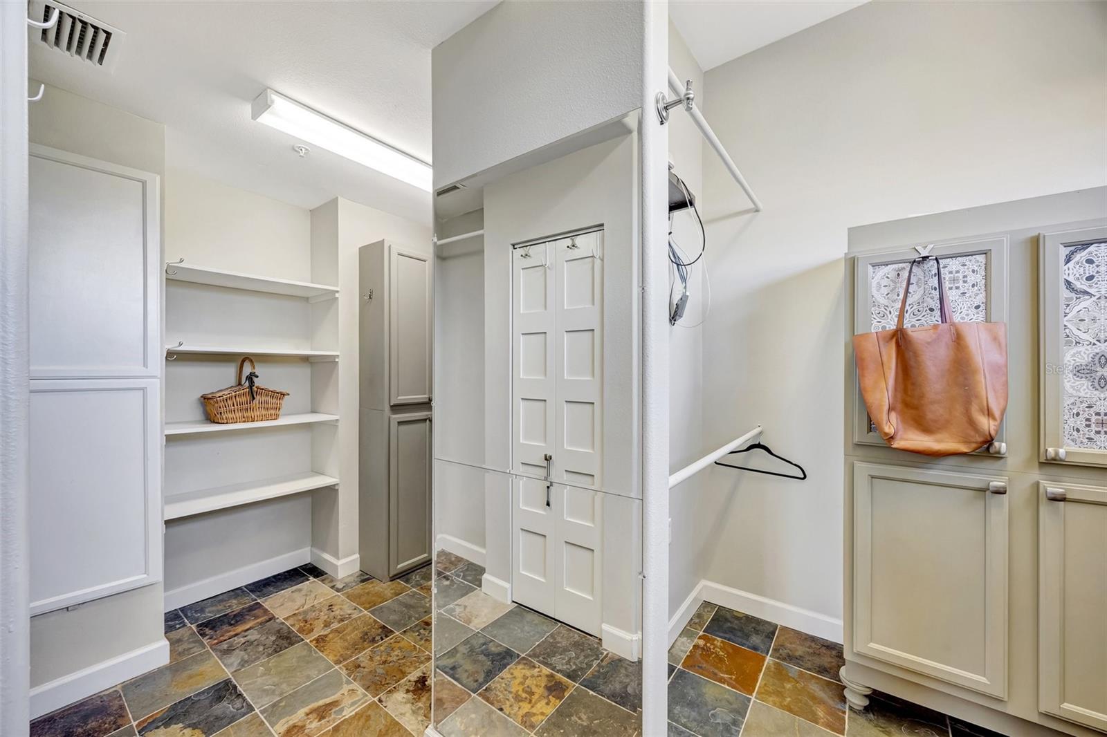 The huge walk-in closet from the primary bath has built-ins throughout.