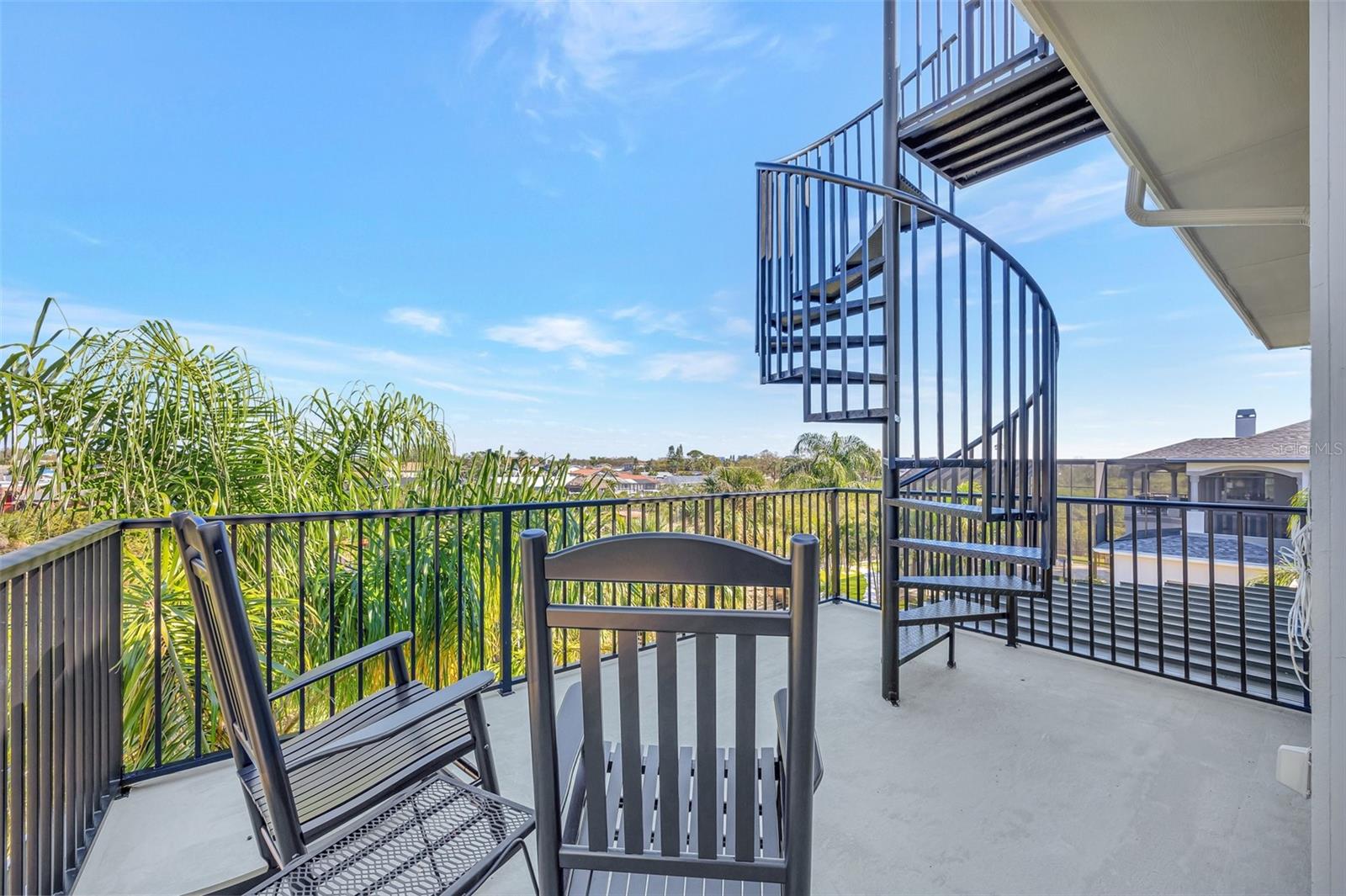 Incredible balcony outside of loft with spiral staircase to the widows walk.