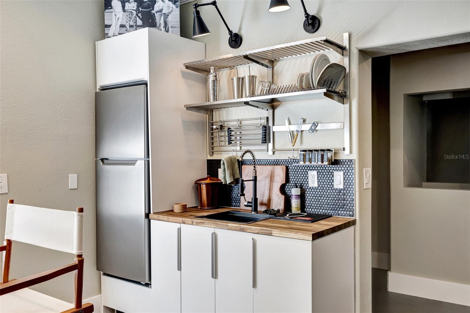 Ground floor: Bar sink even features a glass rinser, refrigerator and ice maker.