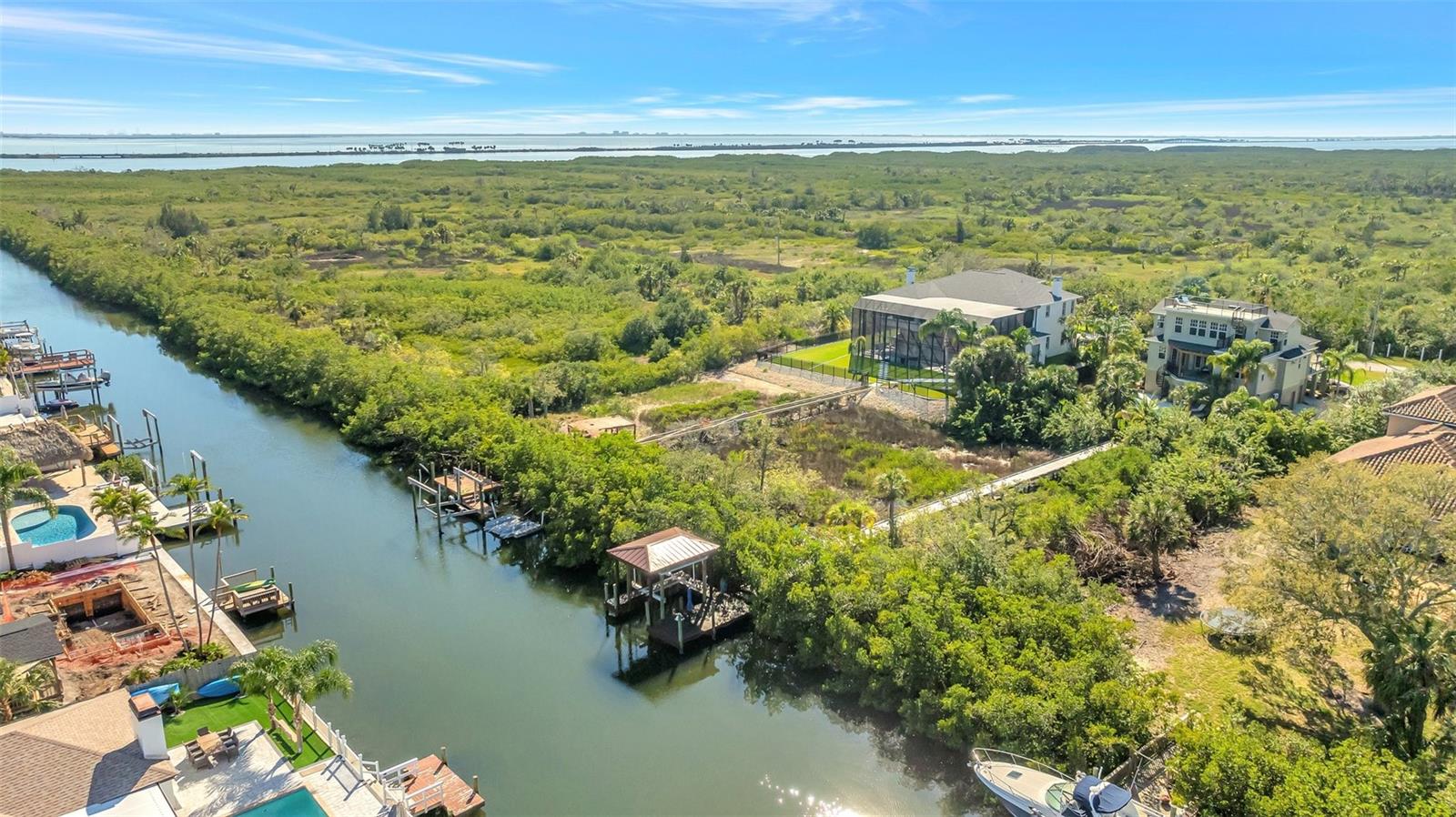 So close to the open bay but nestled on a protected canal with a new 10K lb lift that is covered for maximum protection of your vessel.