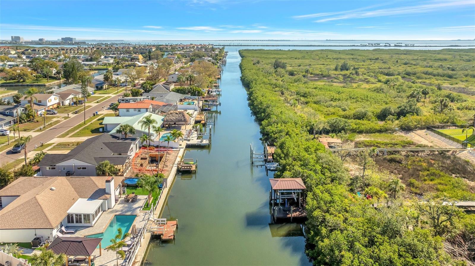 Your brand new covered boat lift on a wide, saltwater canal will take you out to Tampa Bay in just a few minutes.