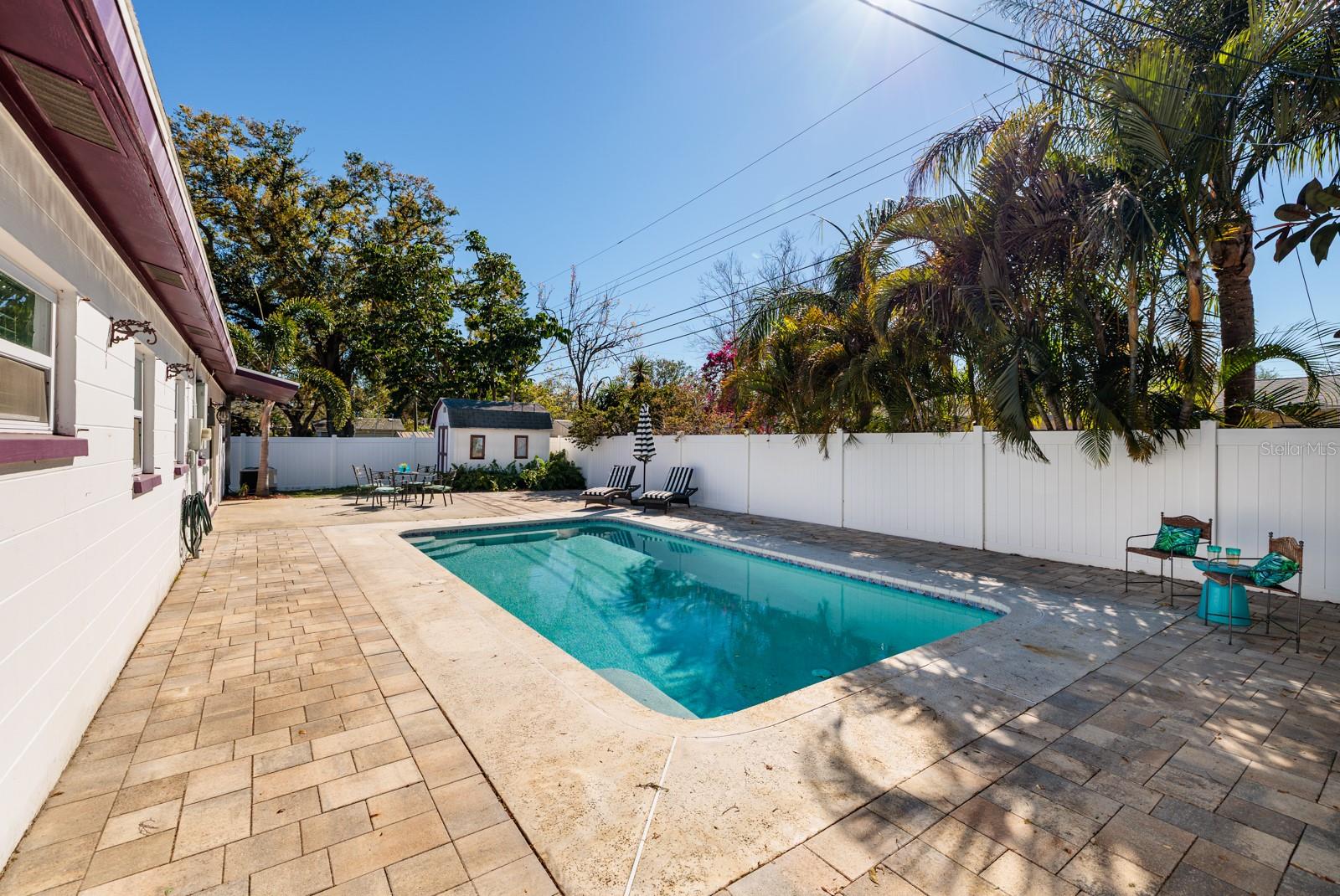 Vinyl fence and pavered patio. Side yards for PETS!