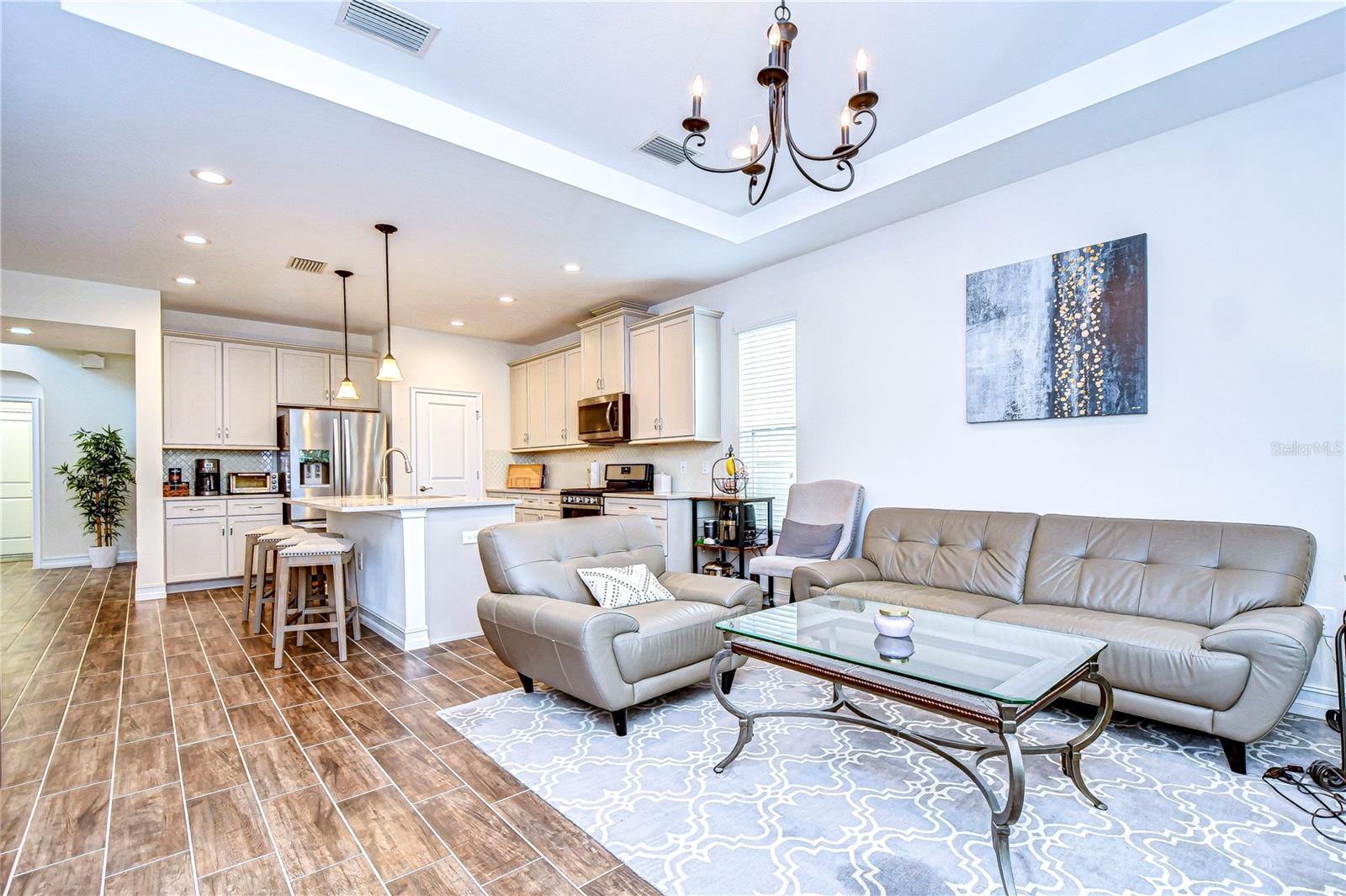 Enjoy bright, airy interiors with a tray ceiling!