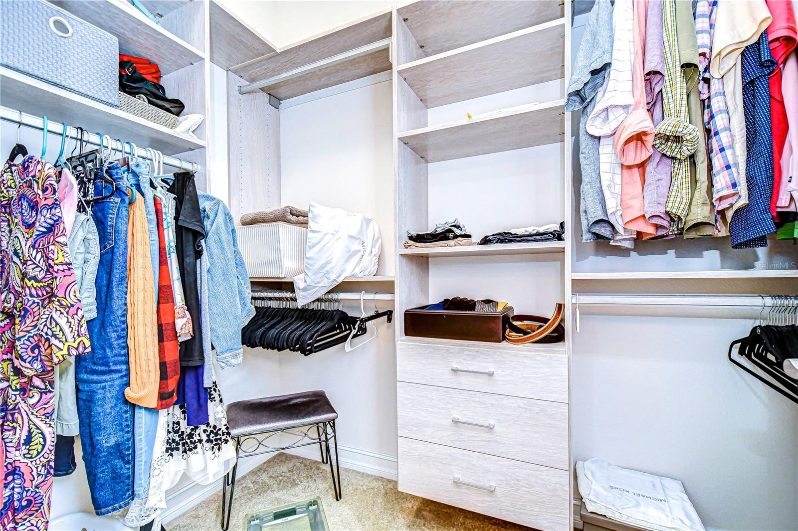 Step into this spacious closet , complete with ample shelving and hanging space