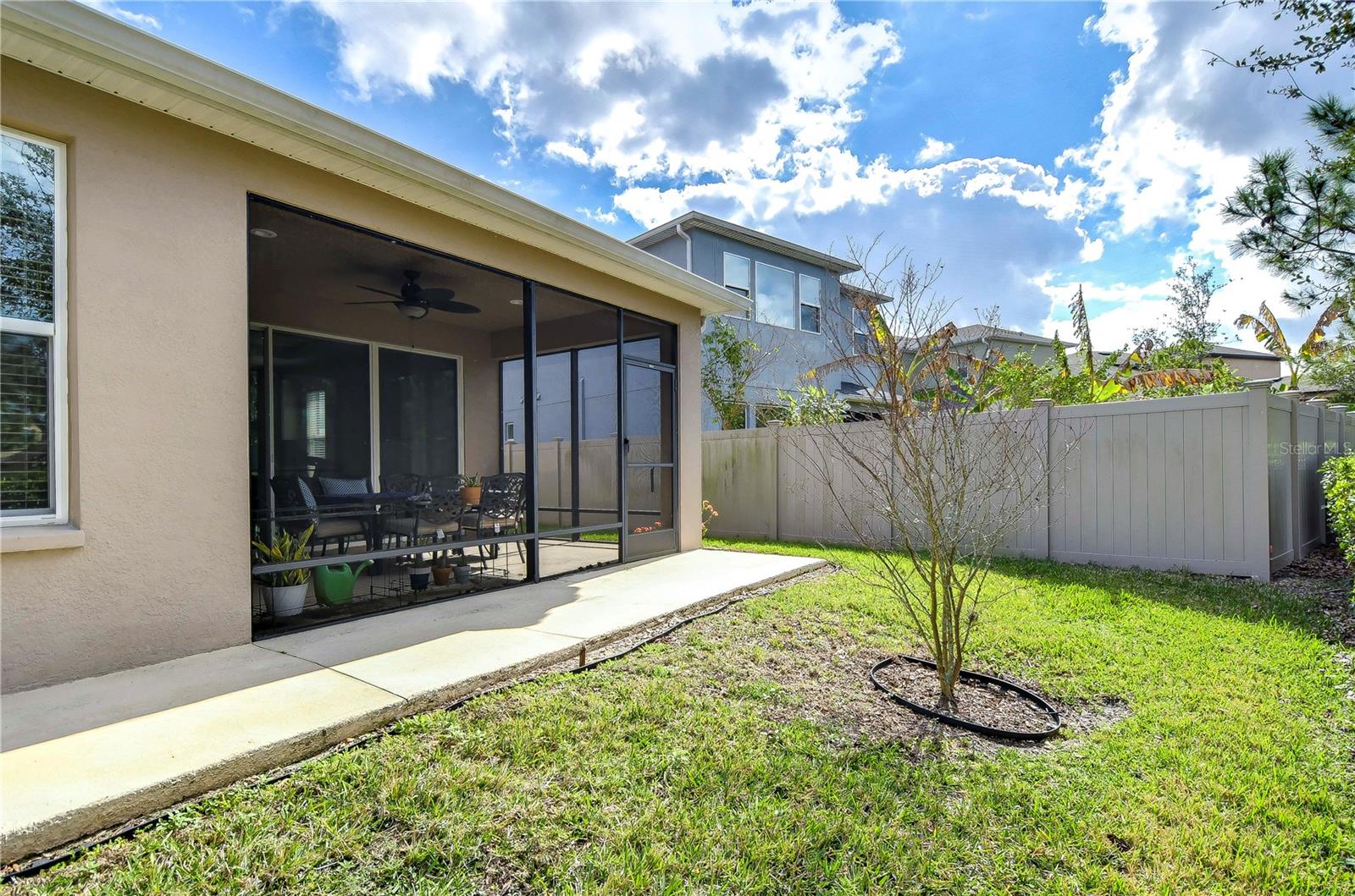 Enjoy tranquil moments in your very own screened patio