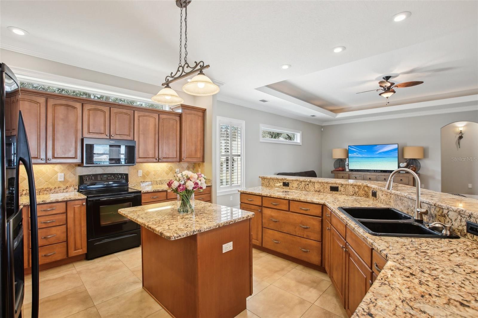 Eat in kitchen with 42 inch cabinets beautiful granite and black appliances