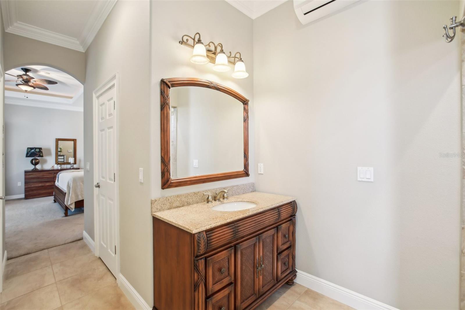 Primary Ensuite bathroom with large double walk in shower and separate vanities