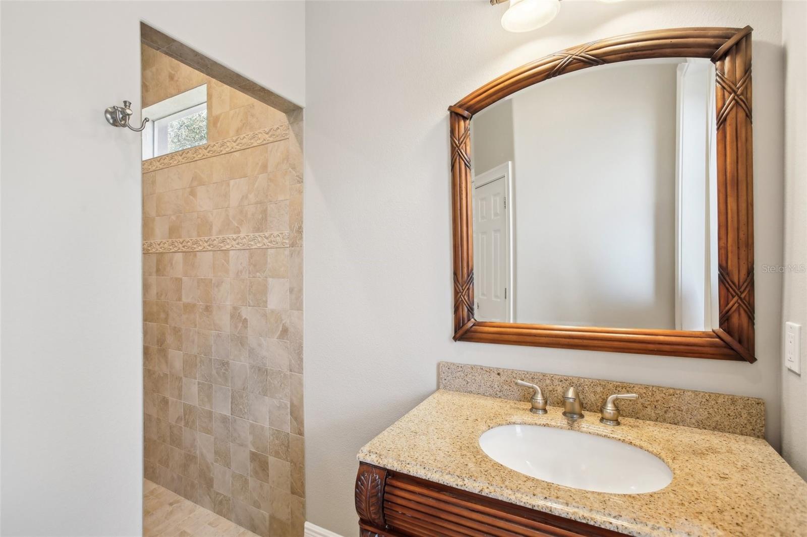 Ensuite bathroom with large double walk in shower and separate vanities