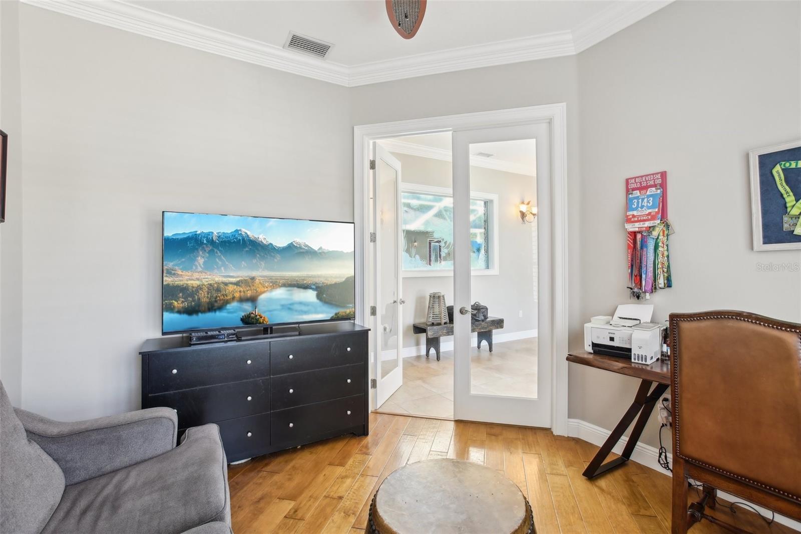 Beautiful office den with hardwood floors and beautiful French doors