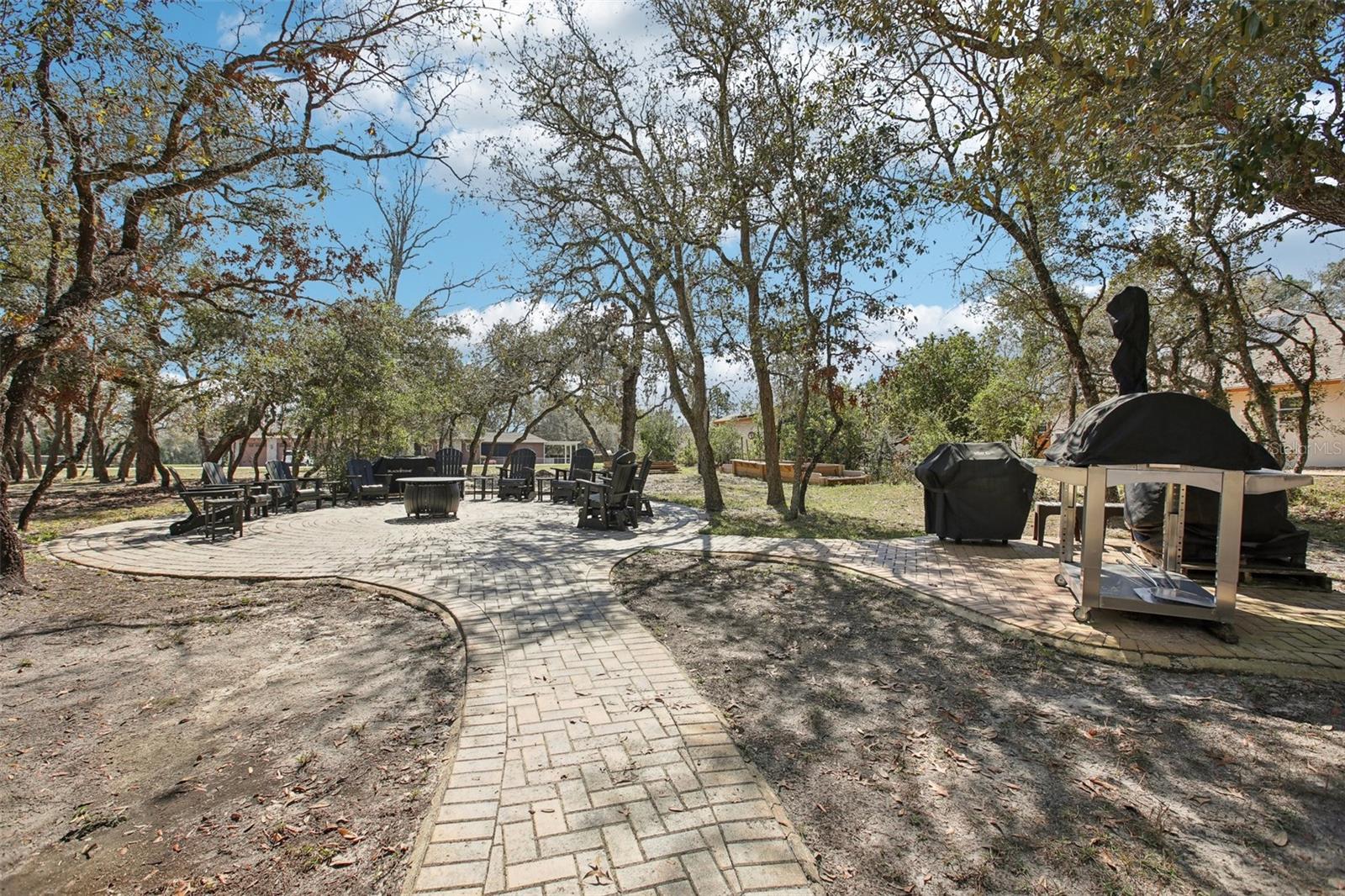 Paved waved walkway to outdoor entertaining and cooking area