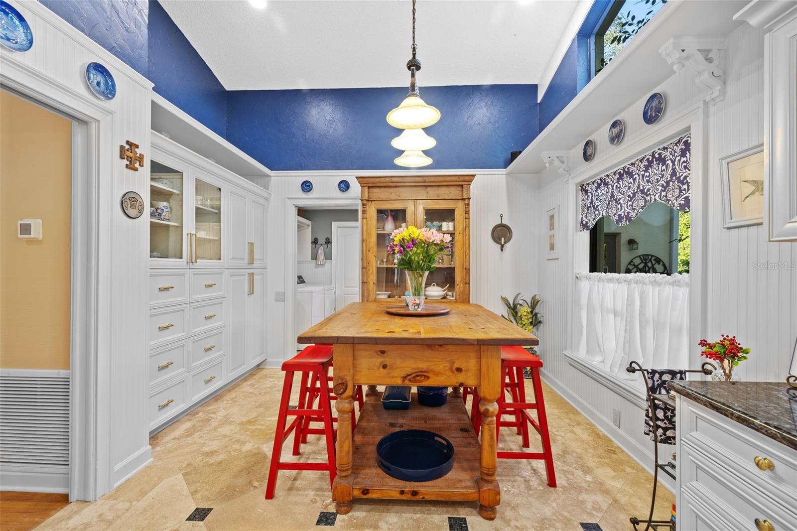 This kitchen table and hutch convey with the sale!