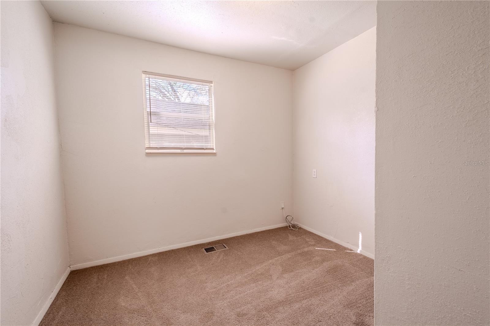 Unit 2 - 3rd bedroom has carpet and a built in closet.