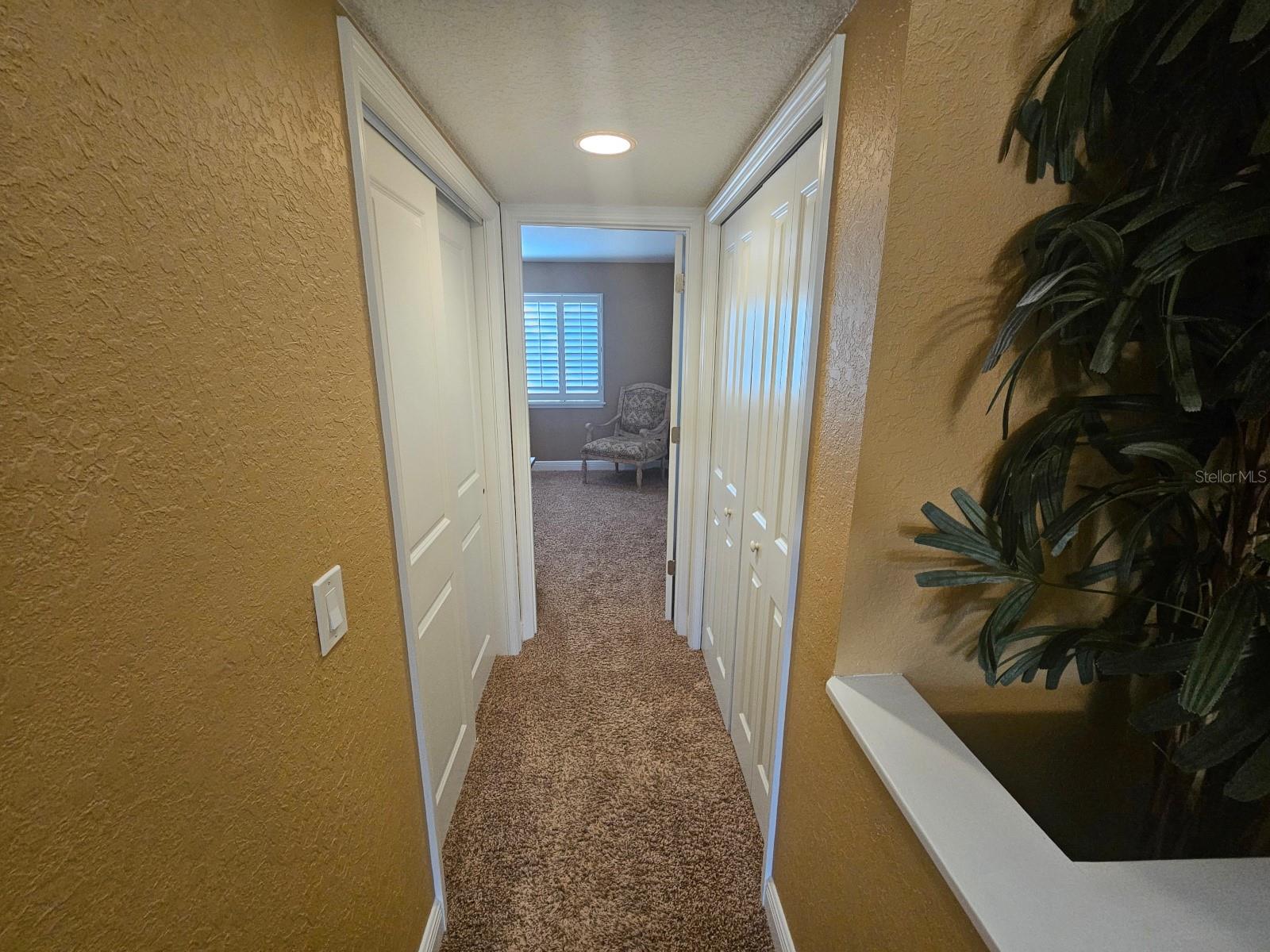 Hall linen closet on the left, laundry on the right