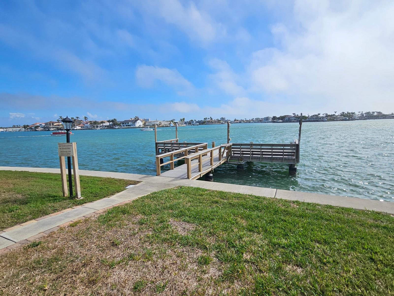 Lighted fishing/courtesy dock with fish cleaning station and ladder into water for paddle boards and kayaks