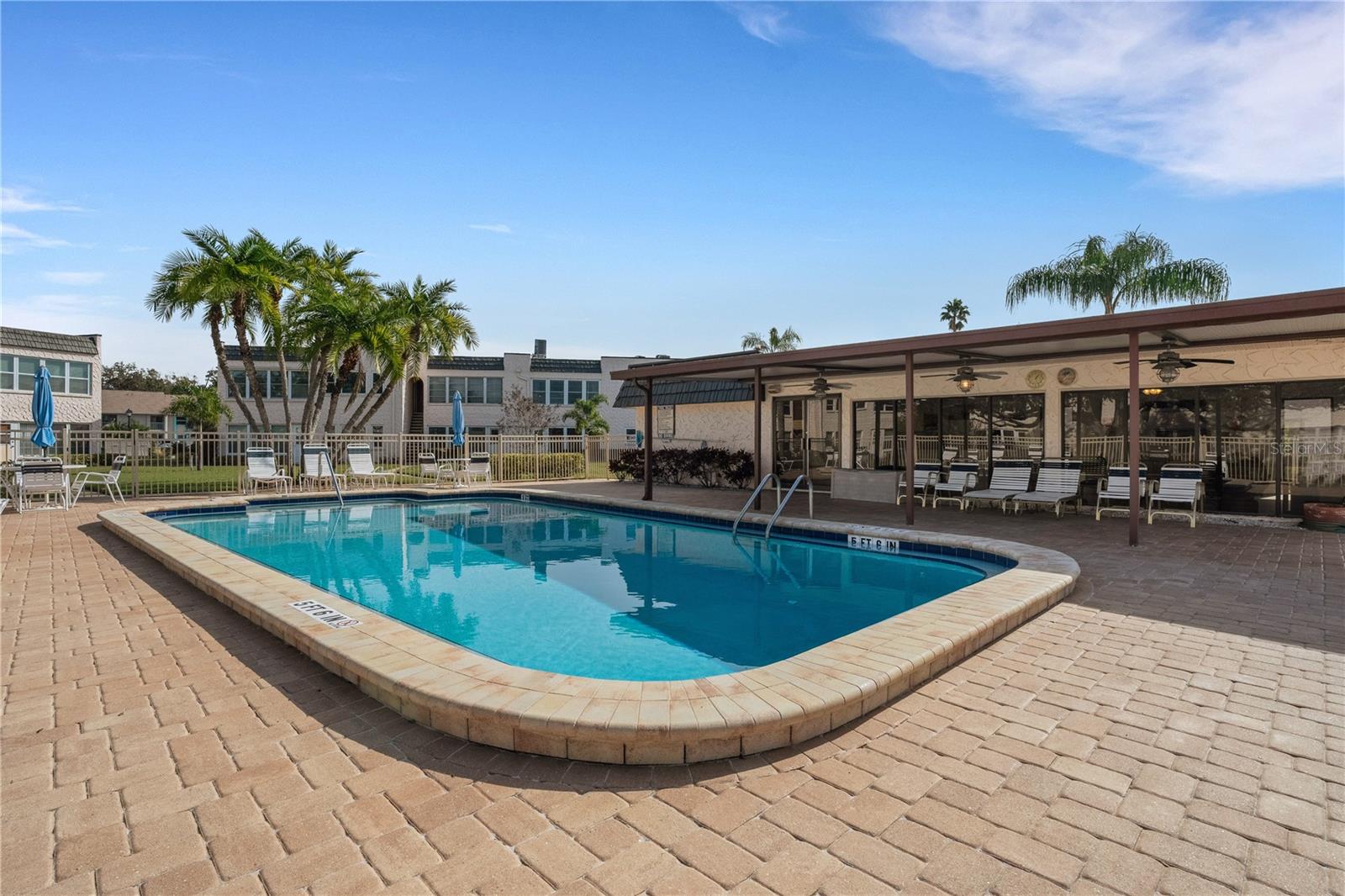 Pool With Covered Patio Deck and Clubhouse