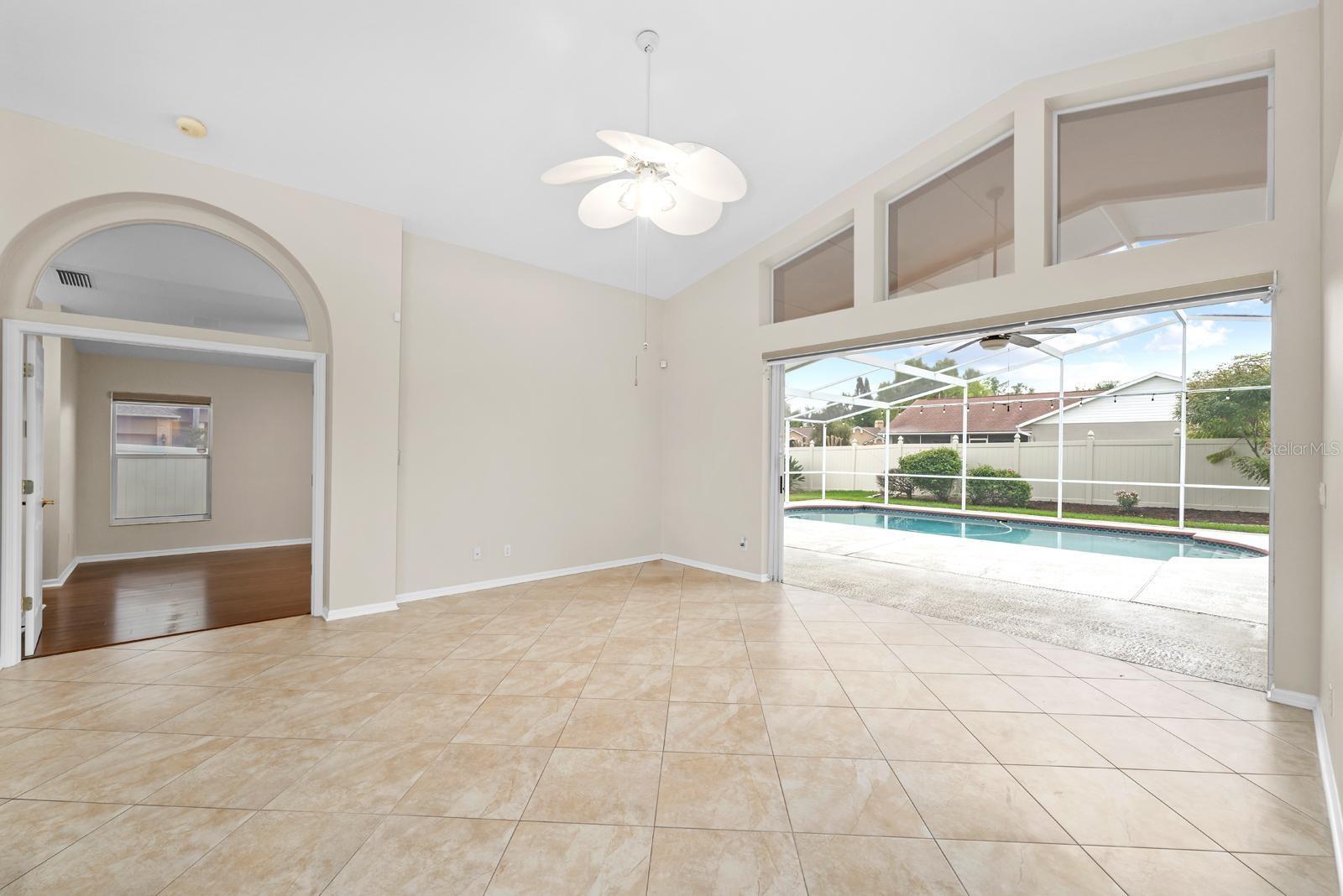 The main living room with the 8' triple-pocket-slider all the way open...and 3 large transom windows that allow extra natural to come in.