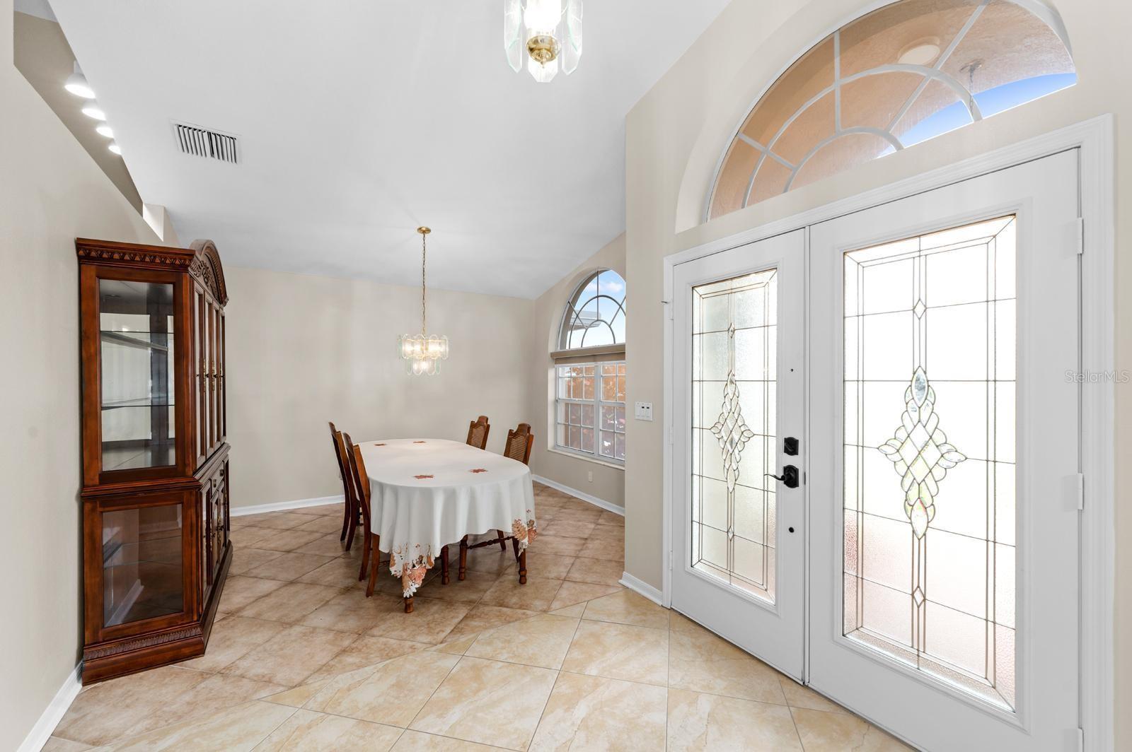 The double front doors and the dining room.