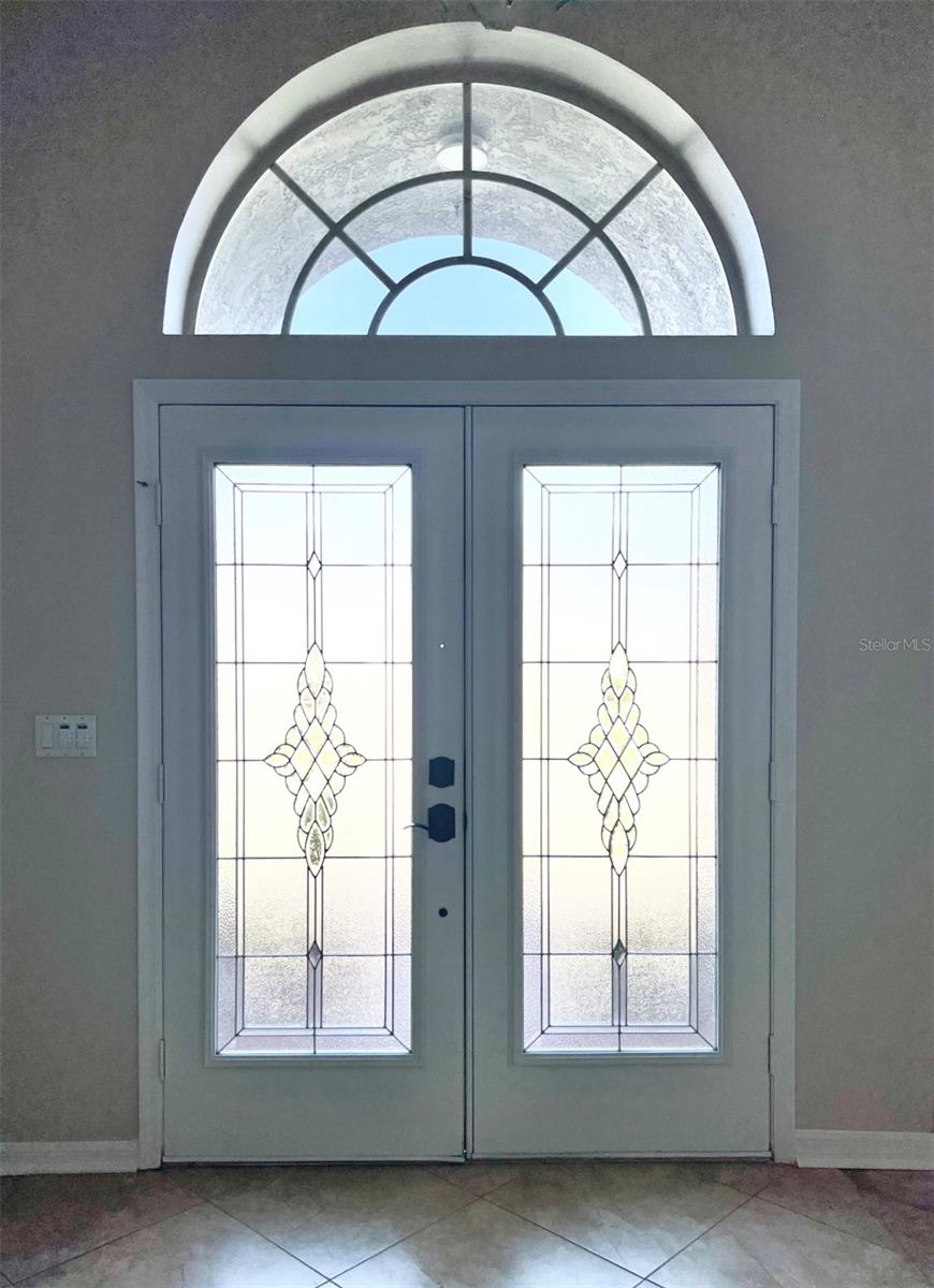 The decorative glass double-entry doors.