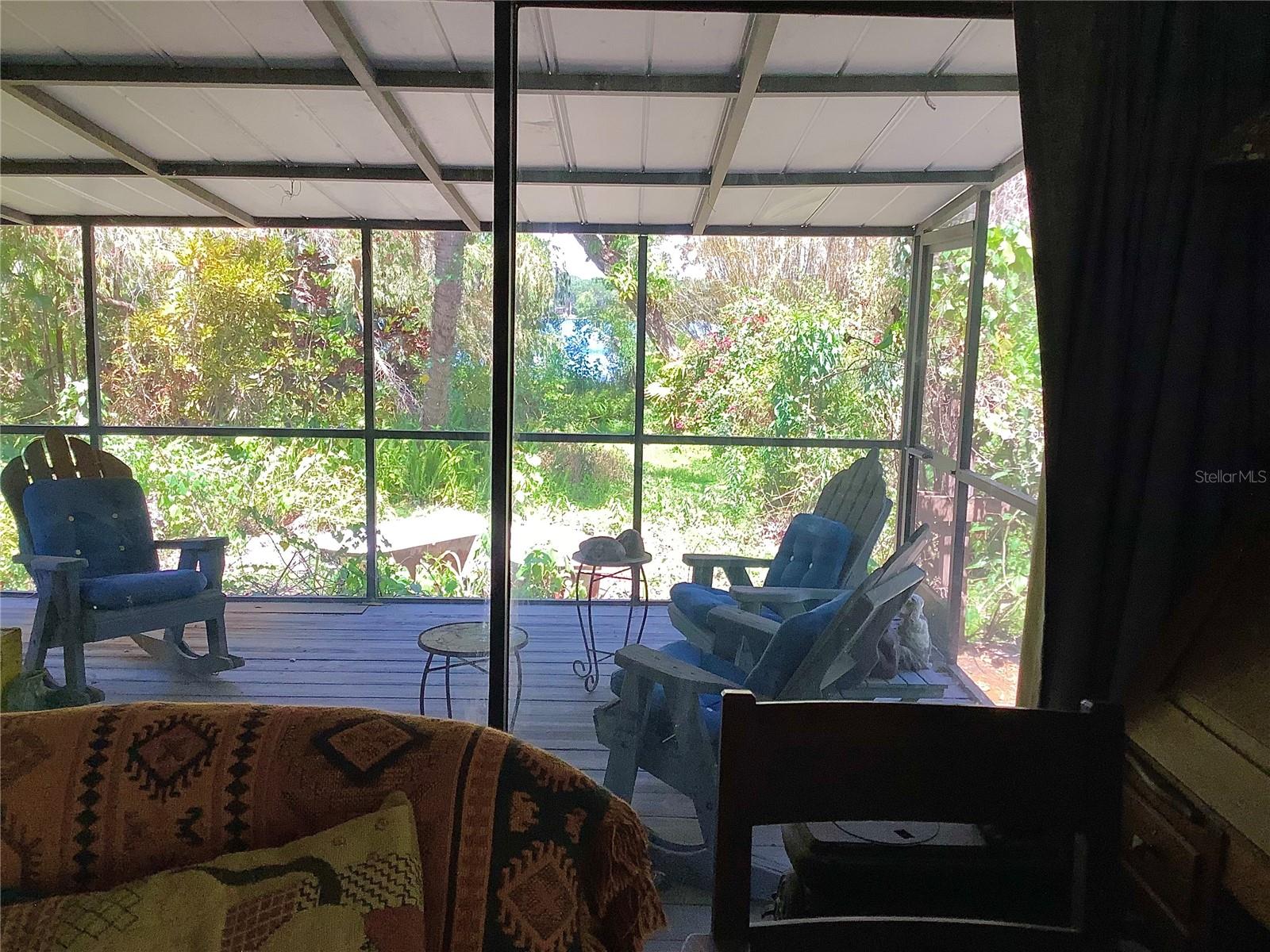 Sliding doors to screened patio off Master BR w view of lake
