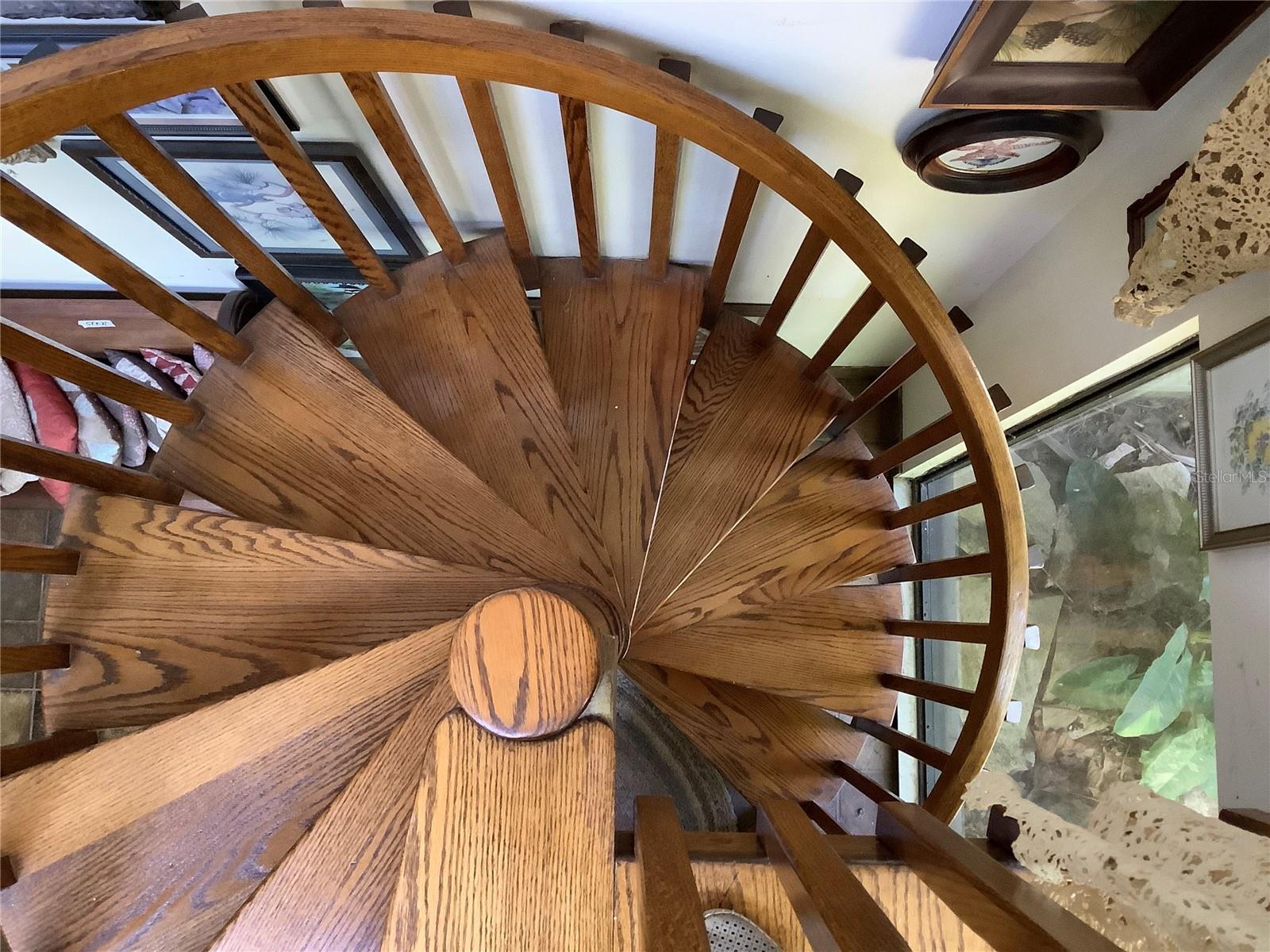 Winding wood staircase to ground floor