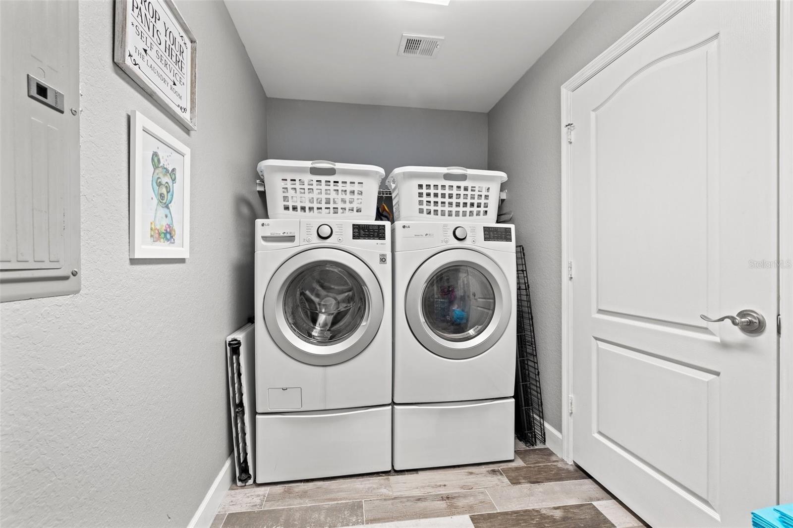 Laundry room with storage closet