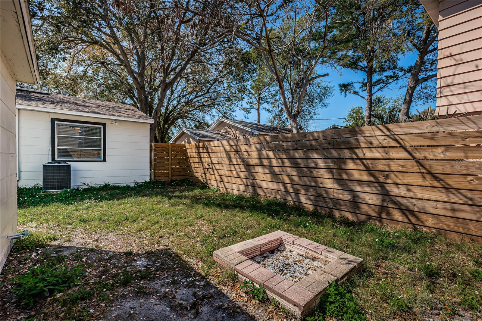 fire pit area with house in background