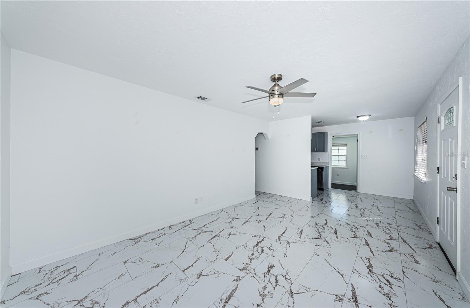 front door on right, entering into the living room.