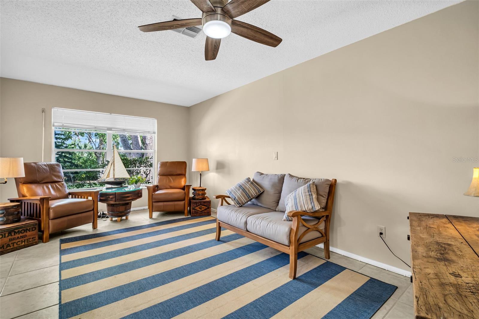 Large window floods the room with natural light~