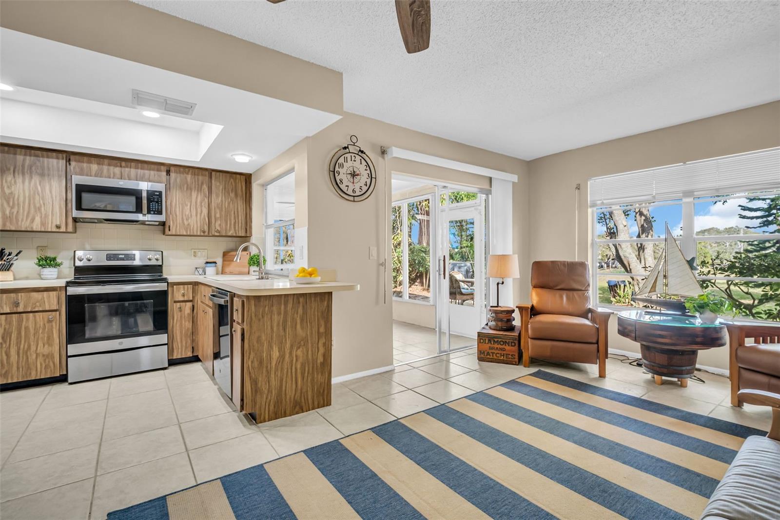 Kitchen with newer lighting and appliances~