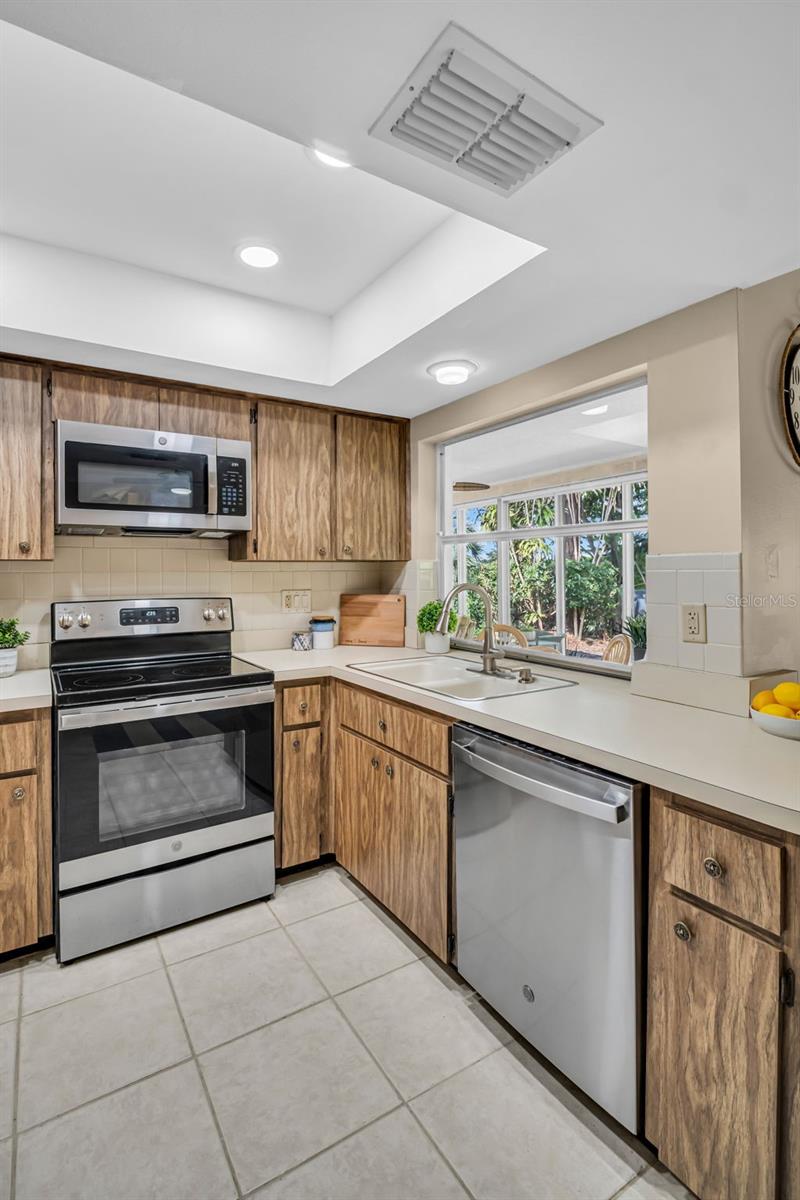 Kitchen has a very handy pass-through to the enclosed lanai~