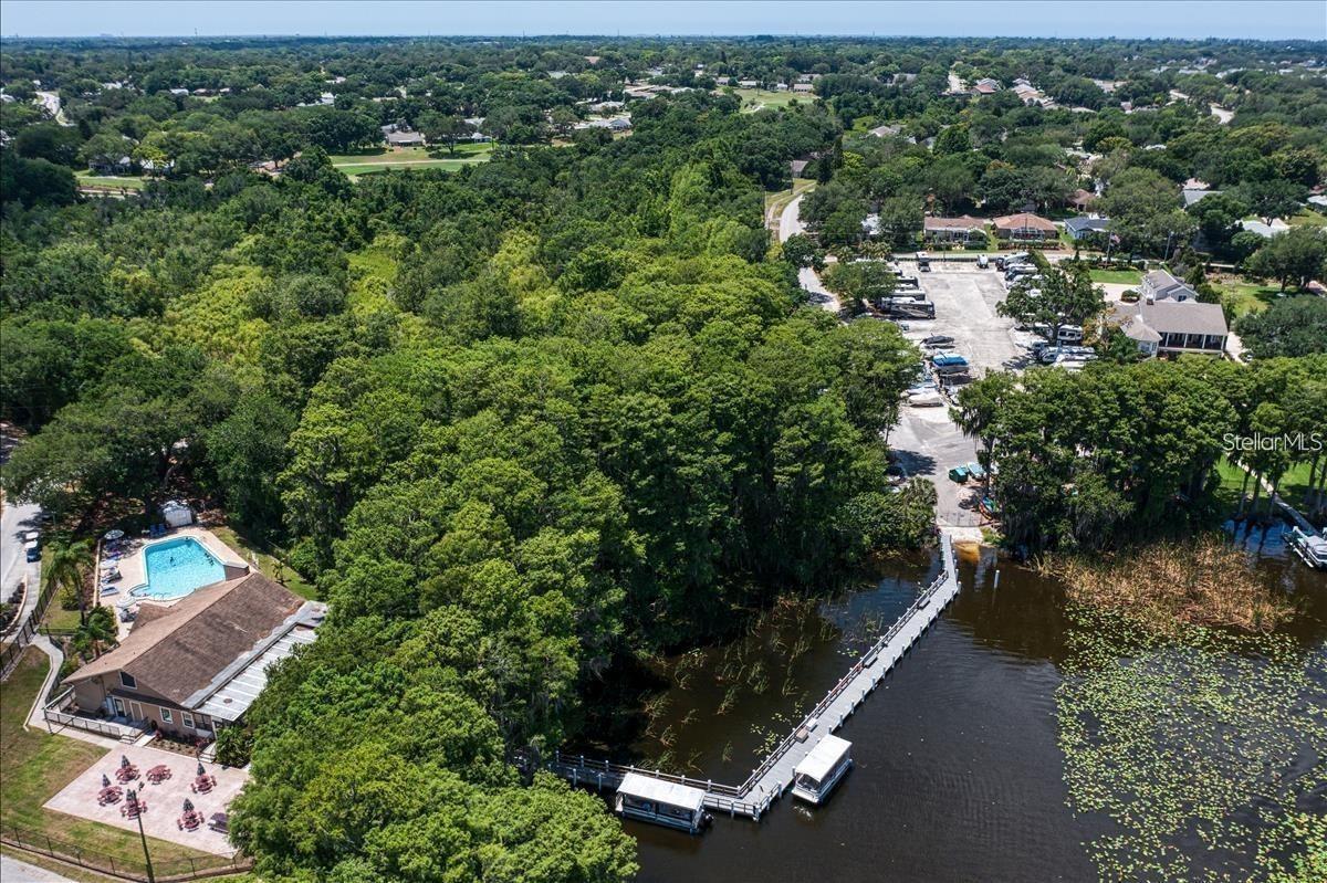 Lake Tarpon connected to RV lot and boat ramp by an open dock & fishing pier~