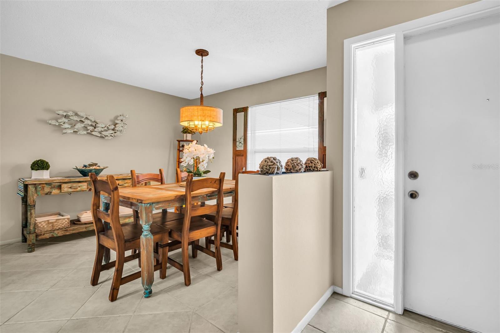 Natural light pours into the dining room through the front windows~