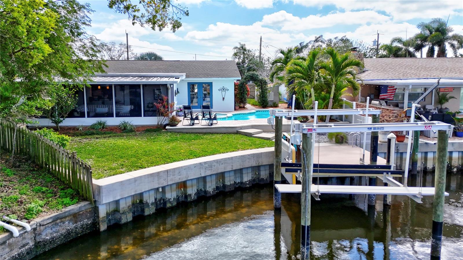 Waterfront with seawall, dock & boat lift