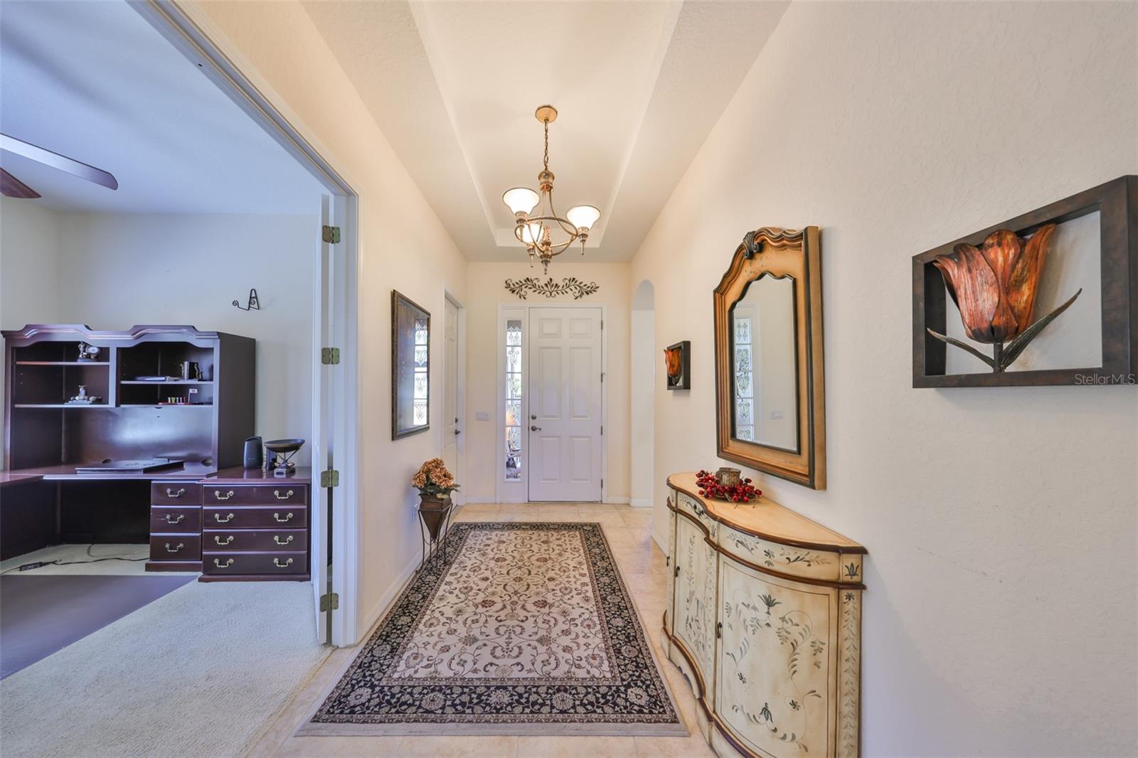 Large Hallway looking towards front door and 3rd bedroom/den