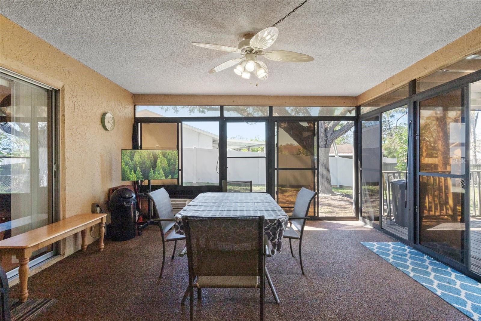 Screen in Patio with vinyl windows and AC window unit