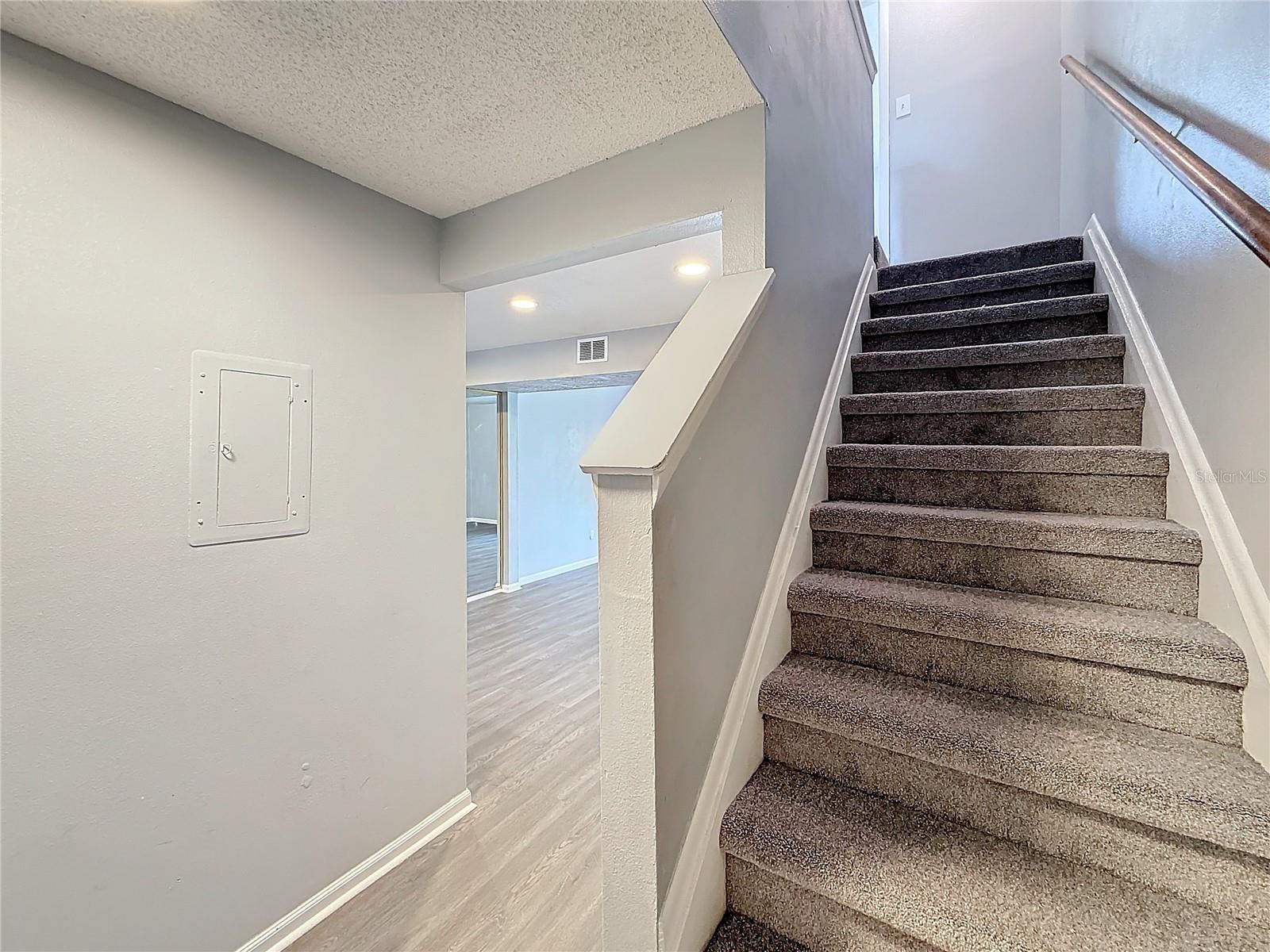 Stairs to bedrooms and full bath