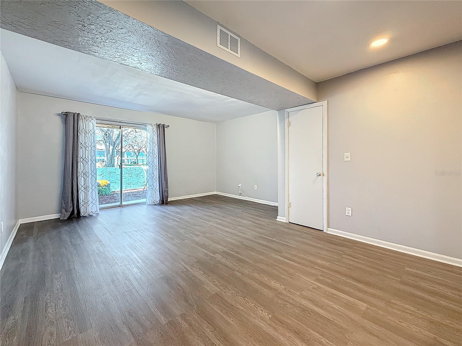 Dining area looking into Living area - cutains open